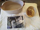a basket and a bowl on a table next to a magazine