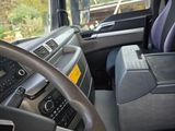 a view of the inside of a truck from the driver ' s seat