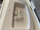 a white sink in the corner of a room