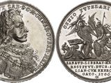 a close up of a coin with an image of a man on a horse