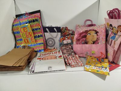 a shelf with a lot of bags and other items on it