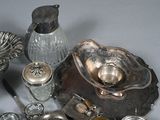a lot of silver items that are on a table