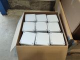 a box full of white boxes sitting on the floor