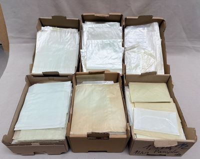 several boxes filled with different types of paper on top of a table