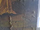 a picture of a painting of a woman on the wall