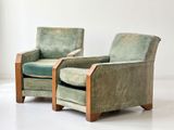 pair of green velvet club chairs with wooden arms and arms