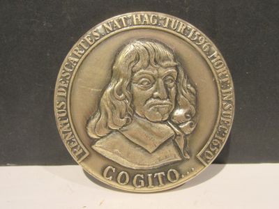 une pièce d'argent sur laquelle figure l'image d'un homme