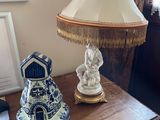 a table with a lamp and a lamp shade on it