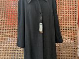 a woman ' s coat on a mannequin mannequin mannequin mannequin mannequin mannequin mannequin mannequin mann