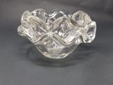 an image of a clear glass bowl with flowers on it