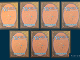 four decks of magic the gathering cards are arranged in a row