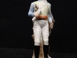 figurine of a man in a uniform holding a sword