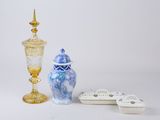 two vases and a bowl sitting next to each other on a table