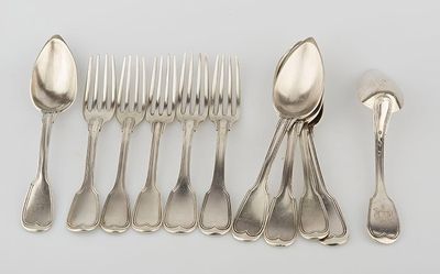 five spoons and six forks on a white table