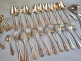 a lot of spoons and spoon spoons on the table