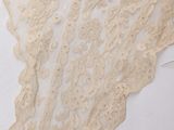a close up of a piece of lace on a mannequin head