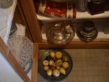 a bowl of apples on the floor next to a bowl of apples