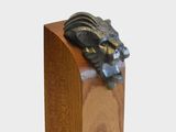 a wooden box with a statue of a dragon on top of it