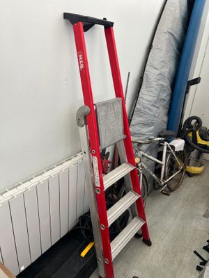 a ladder leaning against a wall in a room