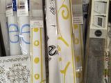 many different types of wallpapers on display in a store