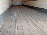 a wooden floor in the back of a truck