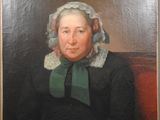 portrait of a woman in a black dress with a white bonnet and a green scarf