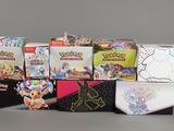 many different types of pokemon trading cards in the box