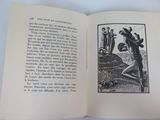 an open book with a picture of a man holding a baseball bat