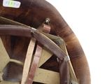 a brown hat with a brown leather strap on it
