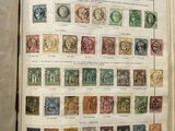 an open book with a bunch of different stamps on it