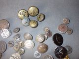 a lot of coins that are on the table