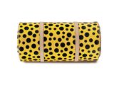 a roll of yellow and black polka dot patterned toilet paper