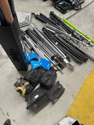 a pile of skis and ski poles on the ground