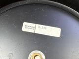 a close up view of a black drum with a label on it