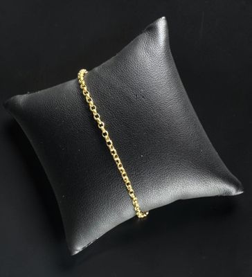 a black pillow with a gold chain on it