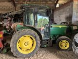 a tractor that is parked in a garage