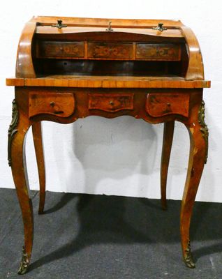 a wooden desk with a drawer on top of it