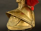 helmet of a roman soldier with a red plume on top of it