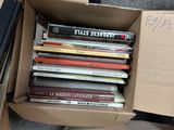 a box full of books sitting on the ground