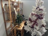 a white christmas tree in the corner of a room