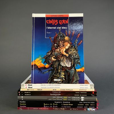 books stacked on top of each other on a gray surface
