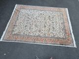 a rug on the ground next to a pair of shoes