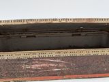 an old wooden box with a lid on a white surface