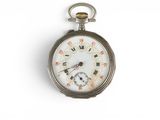 a silver pocket watch with roman numerals on it