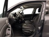 the interior of a car with the door open and the driver ' s seat down