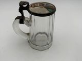 a glass mug with a handle and a handle on it
