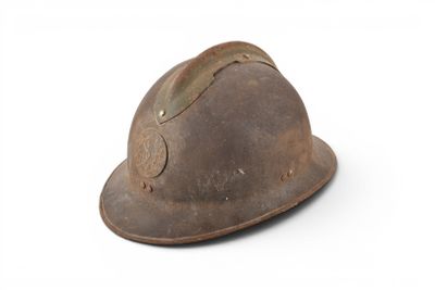 an old helmet on a white surface with a white background