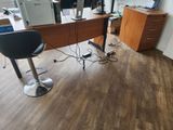 a desk with a chair and a computer on it