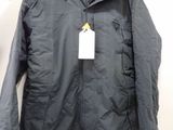 the jacket is black and has a yellow tag on it