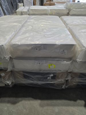 many boxes of mattresses stacked on top of each other